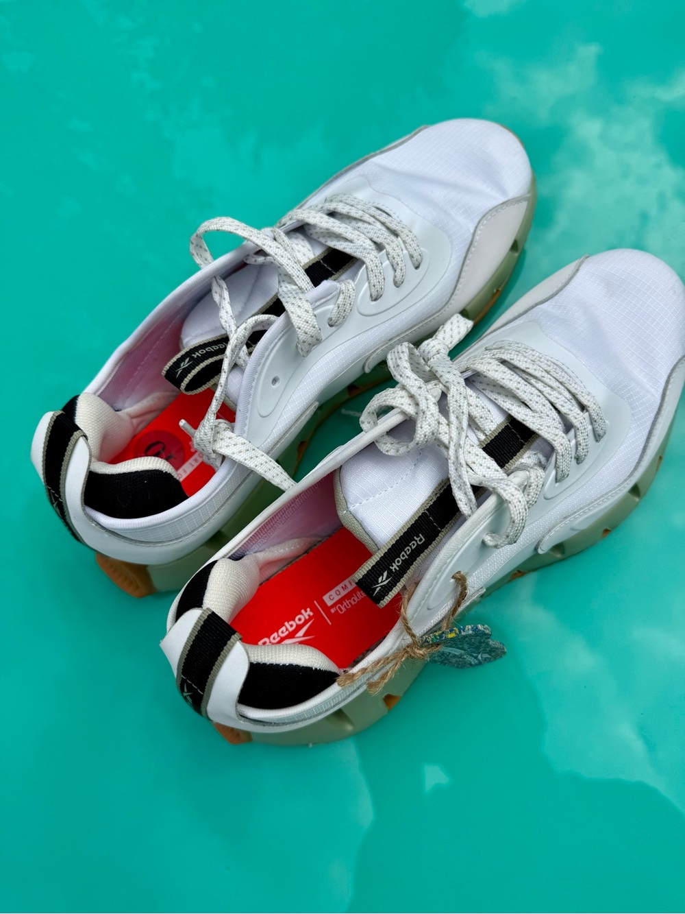 Reebok White Sneakers with Black and Red Details‎